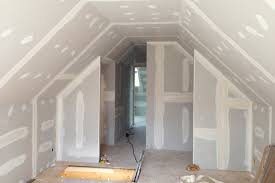 Room under renovation with plasterboard walls and ceiling